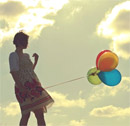 Lady releasing balloons